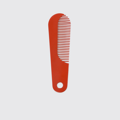 Overhead view of Camper Combi by Martí Guixé Red comb and shoe horn