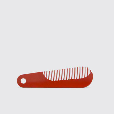 Side view of Camper Combi by Martí Guixé Red comb and shoe horn