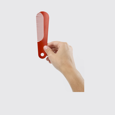 Back view of Camper Combi by Martí Guixé Red comb and shoe horn