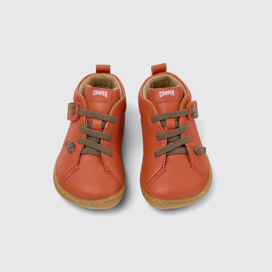 Peu Bottines en cuir orange pour enfant.