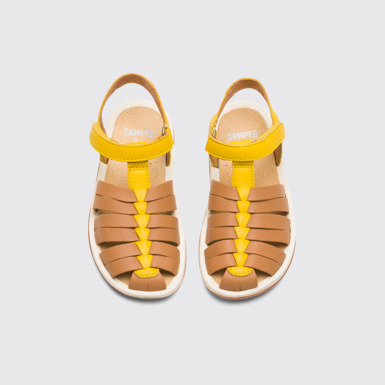 Overhead view of Bicho Closed yellow and tan nude T-strap sandal for kids