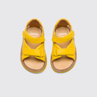 Overhead view of Bicho Yellow strappy kids’ sandal