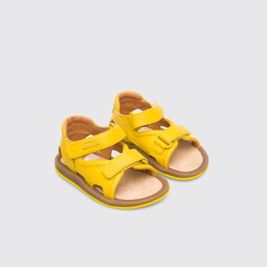 Front view of Bicho Yellow strappy kids’ sandal