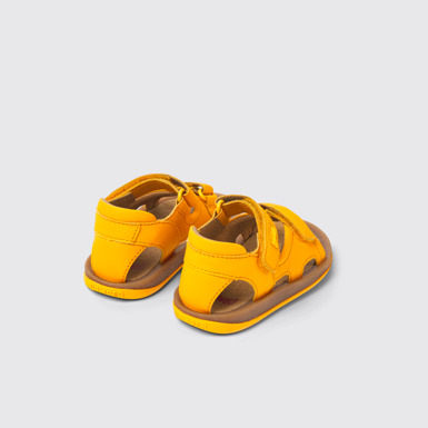Back view of Bicho Yellow leather sandals for kids