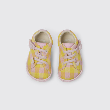 Overhead view of Peu Pink and yellow shoes for kids