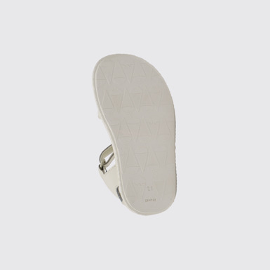 The sole of Miko White, pink, and yellow leather sandals