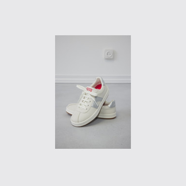A model wearing Runner Multicolor Leather Sneakers for Kids.