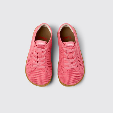 Peu Baskets roses en textile et cuir pour enfants.