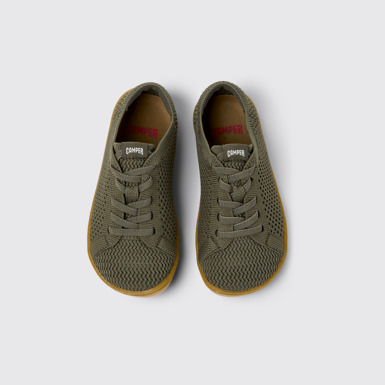 Peu Baskets vertes en textile et cuir pour enfants.