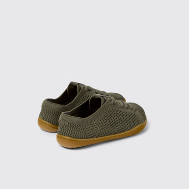 Peu Baskets vertes en textile et cuir pour enfants.