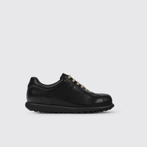 Image of Side view of Pelotas Iconic black shoe for women