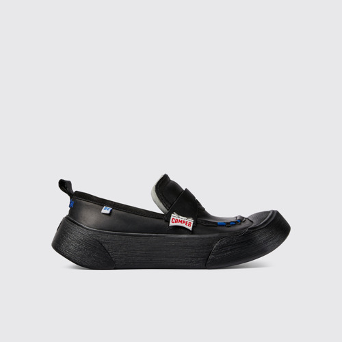 Side view of ADERERROR Black leather shoes