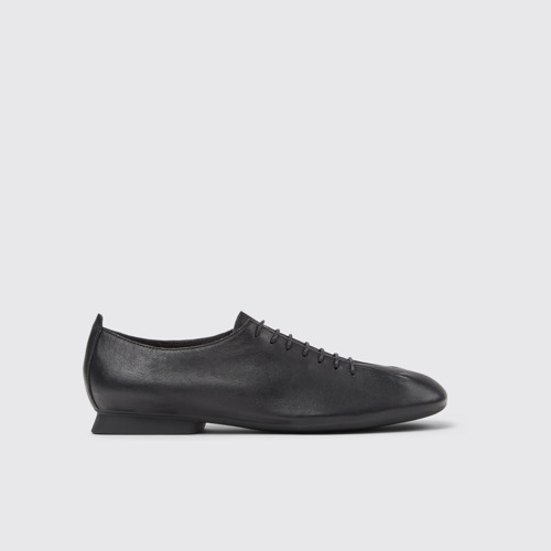 Image of Side view of Casi Myra Black Leather Shoes for Women.