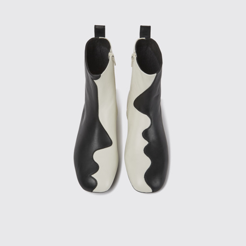 Image of Overhead view of Twins Black and white leather boots