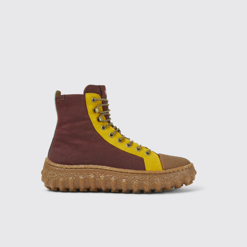 Image of Side view of Ground Burgundy and yellow ankle boots