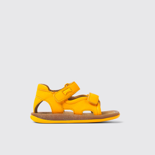 Image of Side view of Bicho Yellow leather sandals for kids