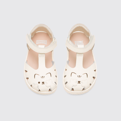 Overhead view of Twins Girl’s cream T-strap sandal
