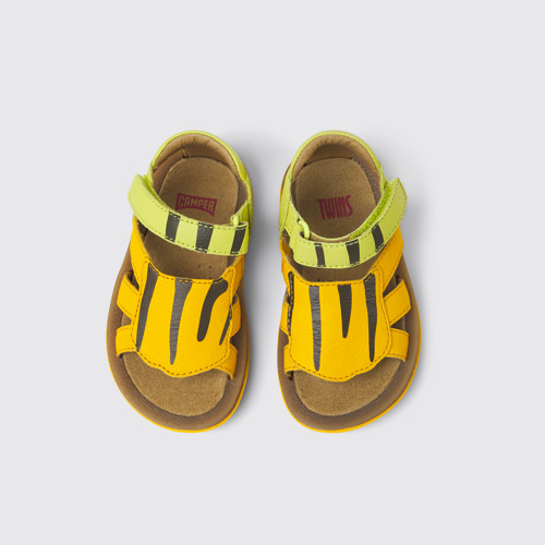 Overhead view of Twins Green and orange leather sandals for kids