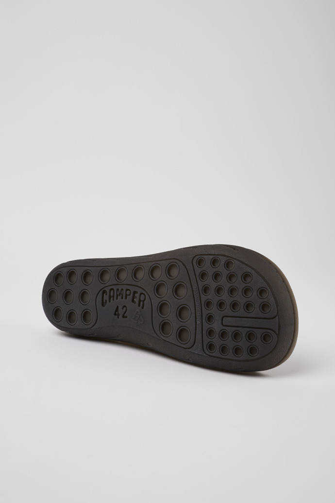 The soles of Wabi Black monomaterial sandals for men