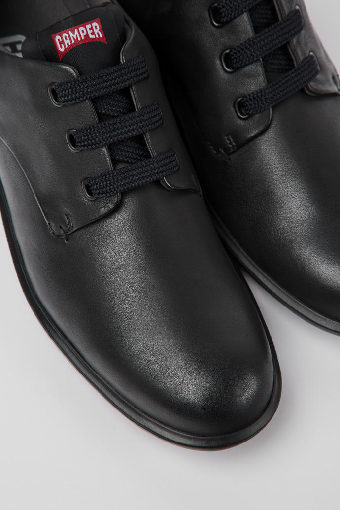 Close-up view of Atom Work Black leather blucher shoes
