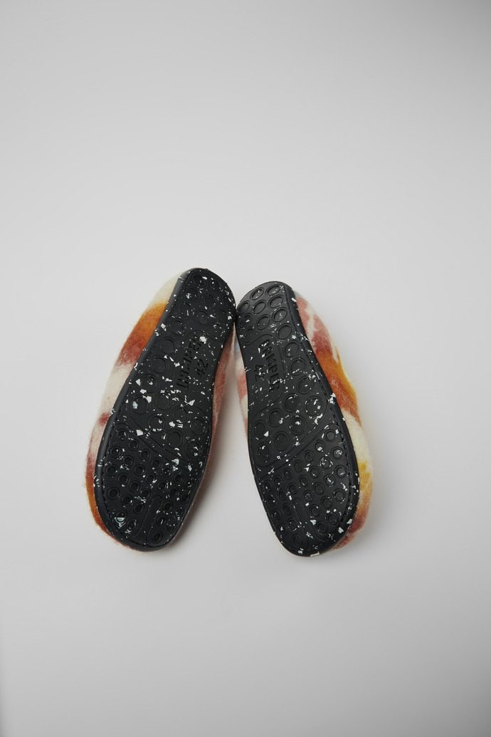 The soles of Wabi Orange and blue recycled wool slippers for men