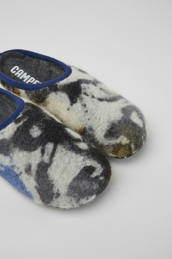 Close-up view of Wabi Blue and black recycled wool slippers for men