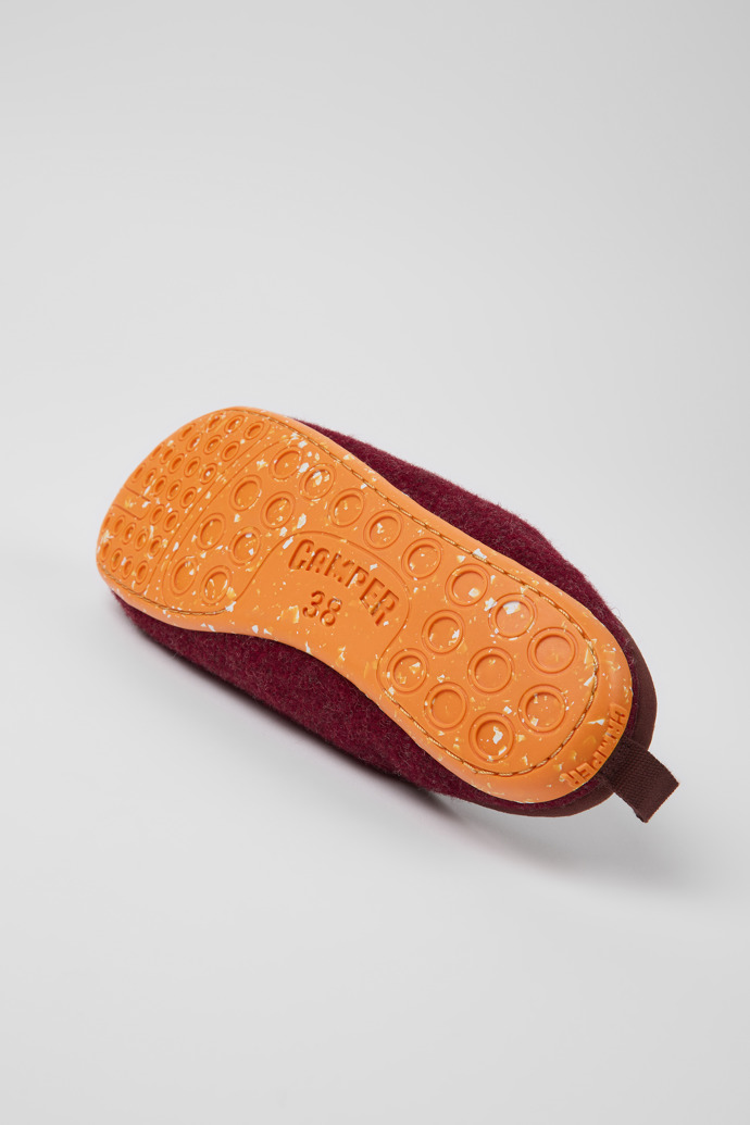 The soles of Wabi Burgundy wool slippers for women