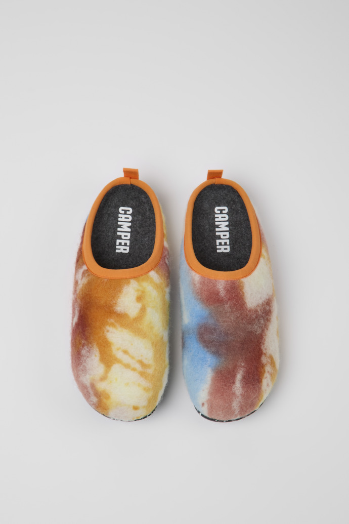 Overhead view of Wabi Orange, blue, and white recycled wool slippers for women