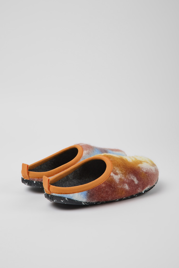 Back view of Wabi Orange, blue, and white recycled wool slippers for women