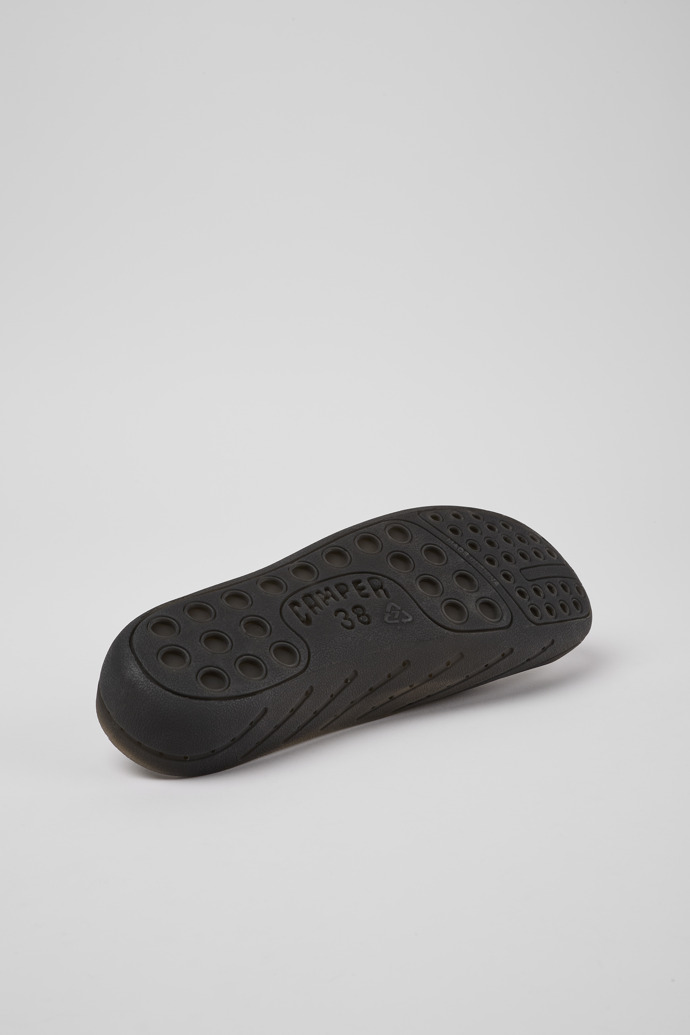 The soles of Wabi Black monomaterial sandals for women