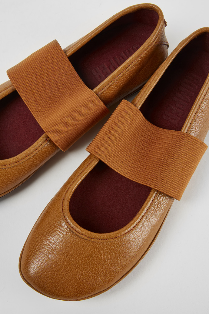 Close-up view of Right Brown leather ballerina shoes