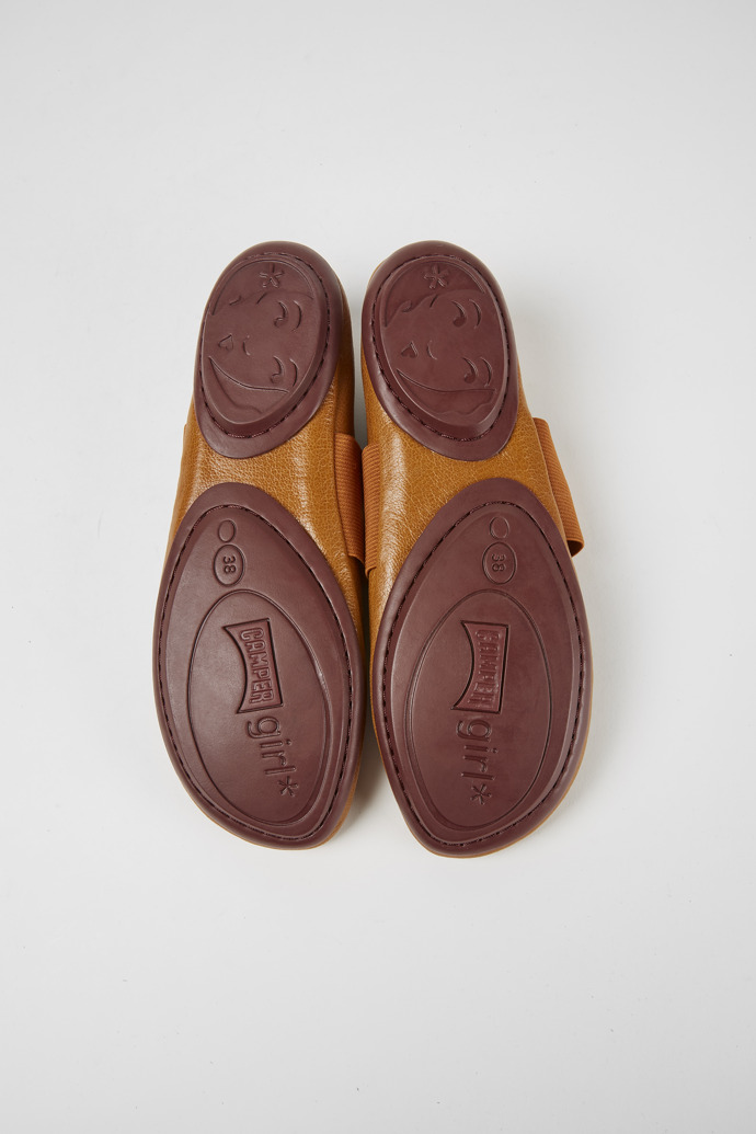 The soles of Right Brown leather ballerina shoes