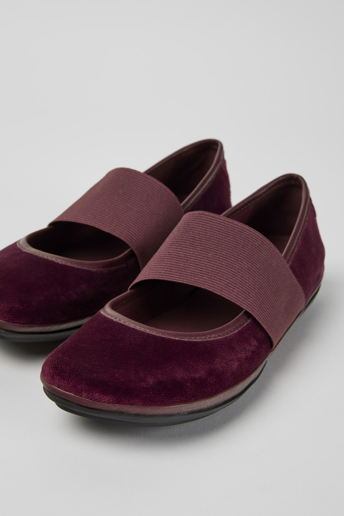 Close-up view of Right Burgundy ballerina shoes