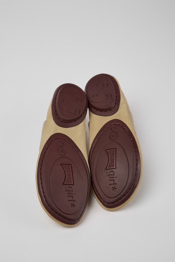The soles of Right Beige nubuck shoes for women