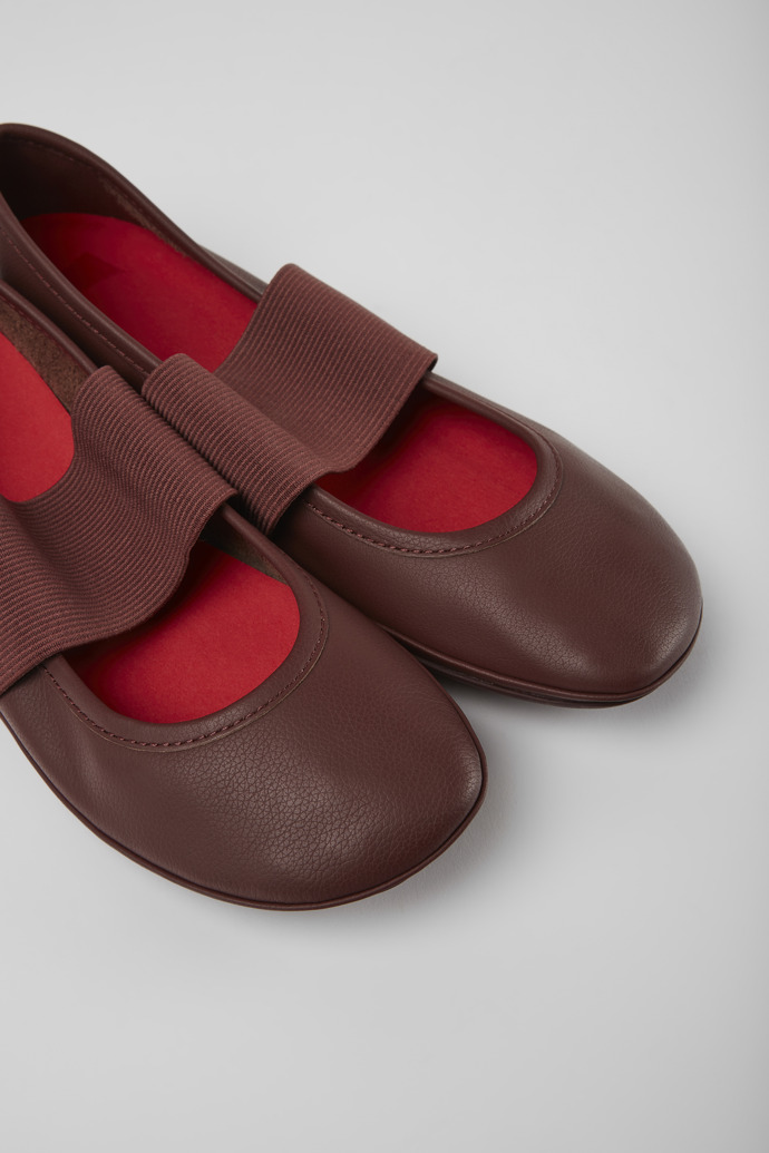 Close-up view of Right Burgundy leather ballerina flats for women
