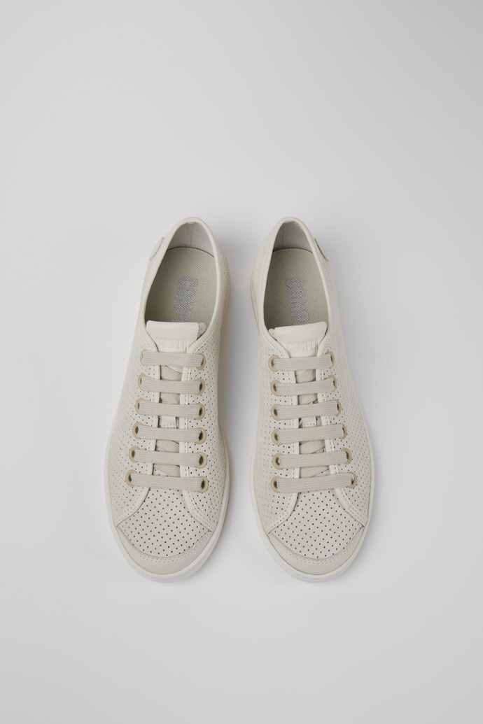 Overhead view of Uno Beige and white leather sneakers for women