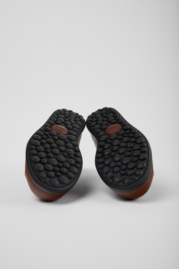 The soles of Pelotas Brown leather shoes for women