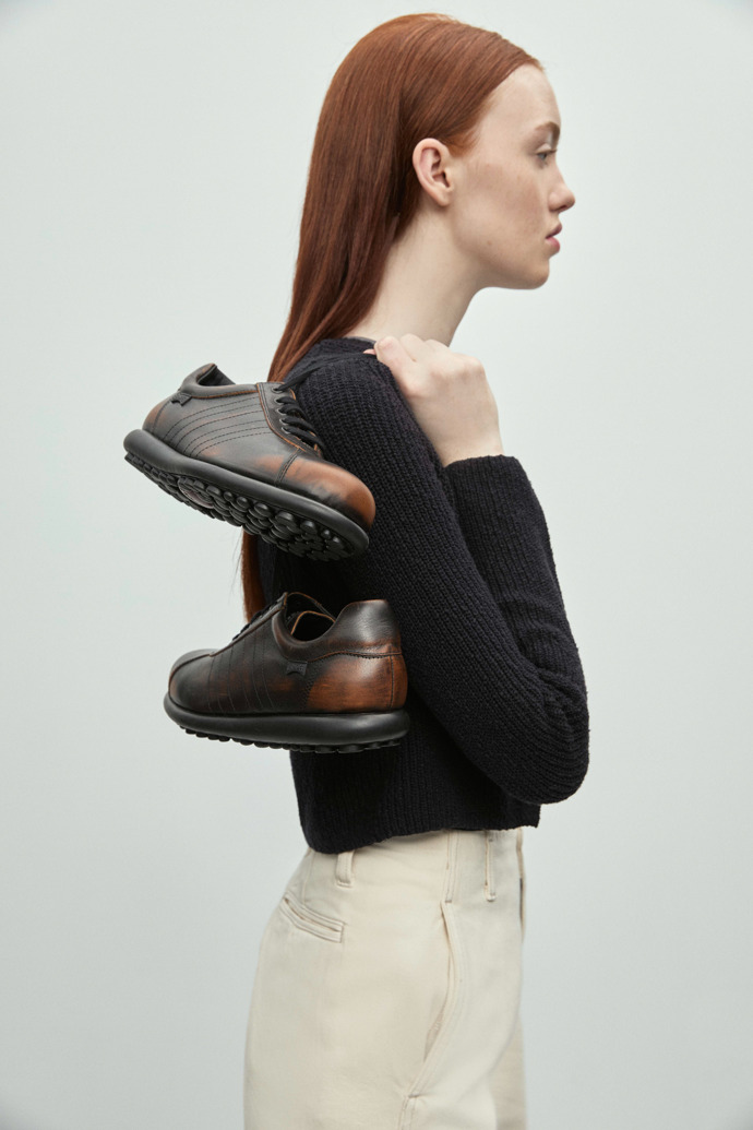 A model wearing Pelotas Bi-color Leather Shoes for Women