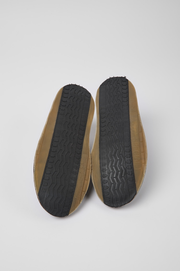 The soles of ReCrafted Black leather shoes for women