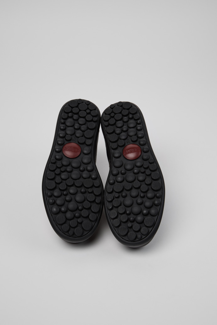 The soles of Twins Black Leather Shoes for Women.