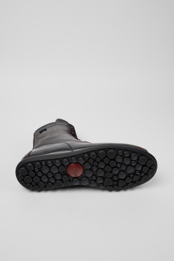 The soles of Pelotas Multicolor Leather Mid Boots for Men.