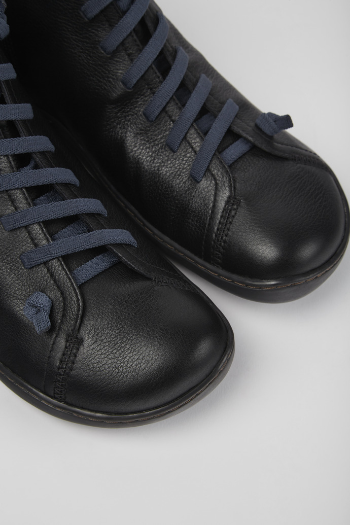 Close-up view of Peu Black leather ankle boots for men