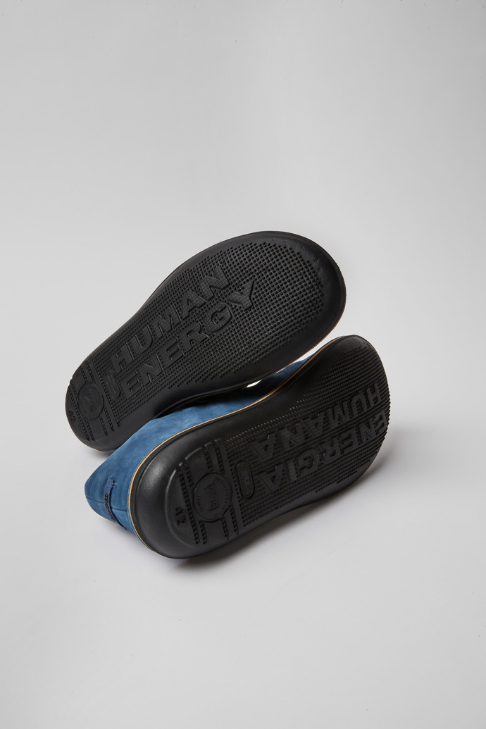 The soles of Beetle Blue nubuck sneakers