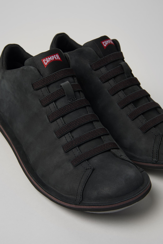 Close-up view of Beetle Black leather sneakers