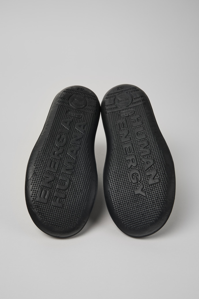 The soles of Beetle Black leather sneakers