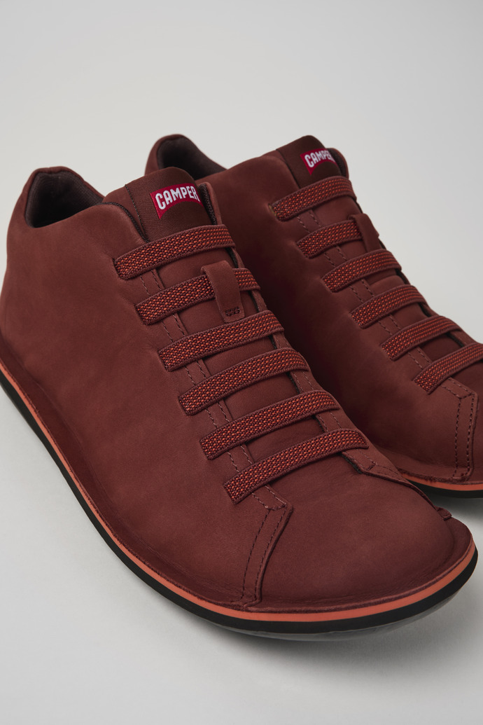 Close-up view of Beetle Red nubuck sneakers