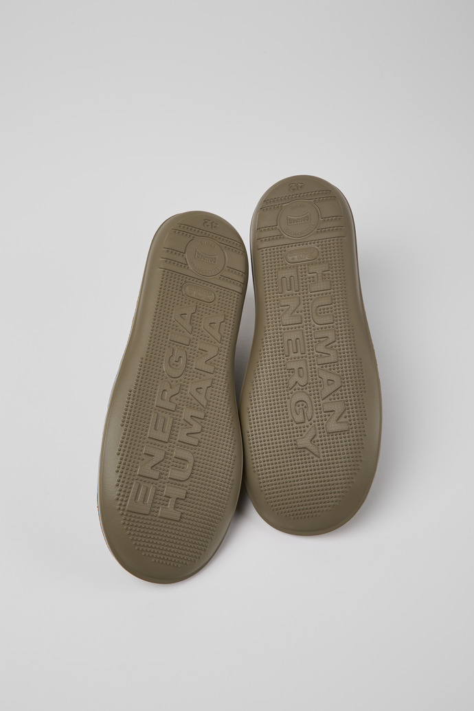 The soles of Beetle Green nubuck sneakers for men