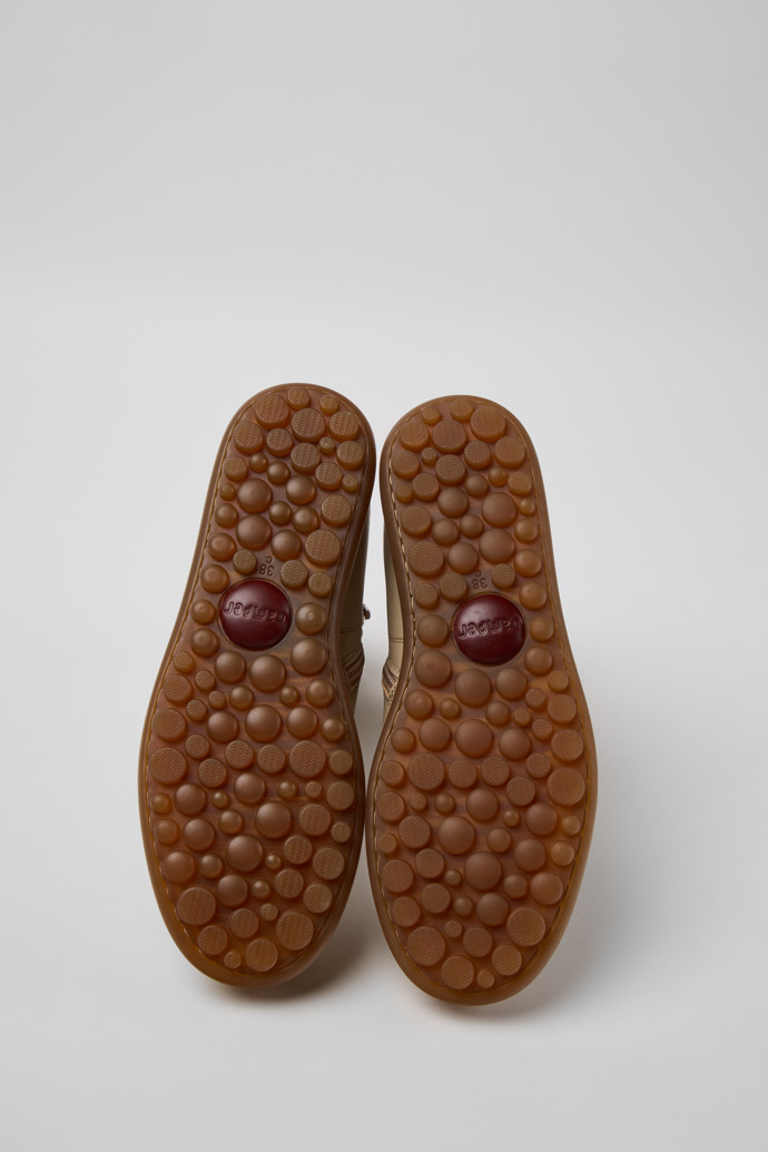 The soles of Pelotas Beige Vegetable-Tanned Leather Ankle Boots for Women.
