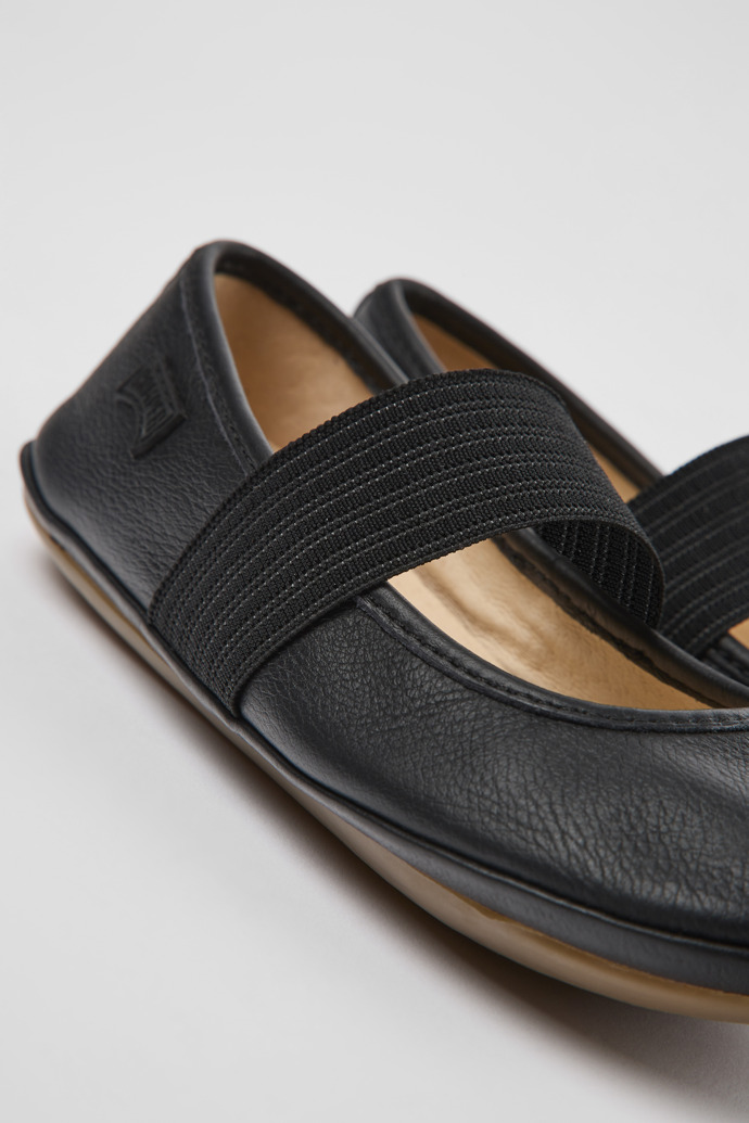 Close-up view of Right Black leather ballerinas for kids