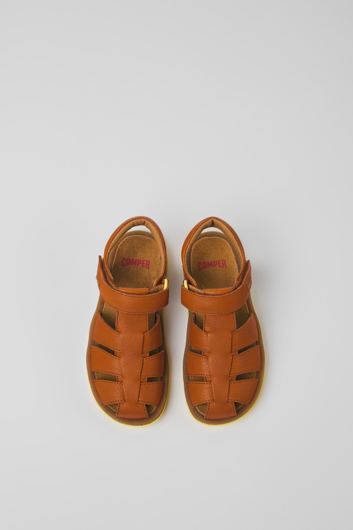 Overhead view of Bicho Brown leather sandals for kids